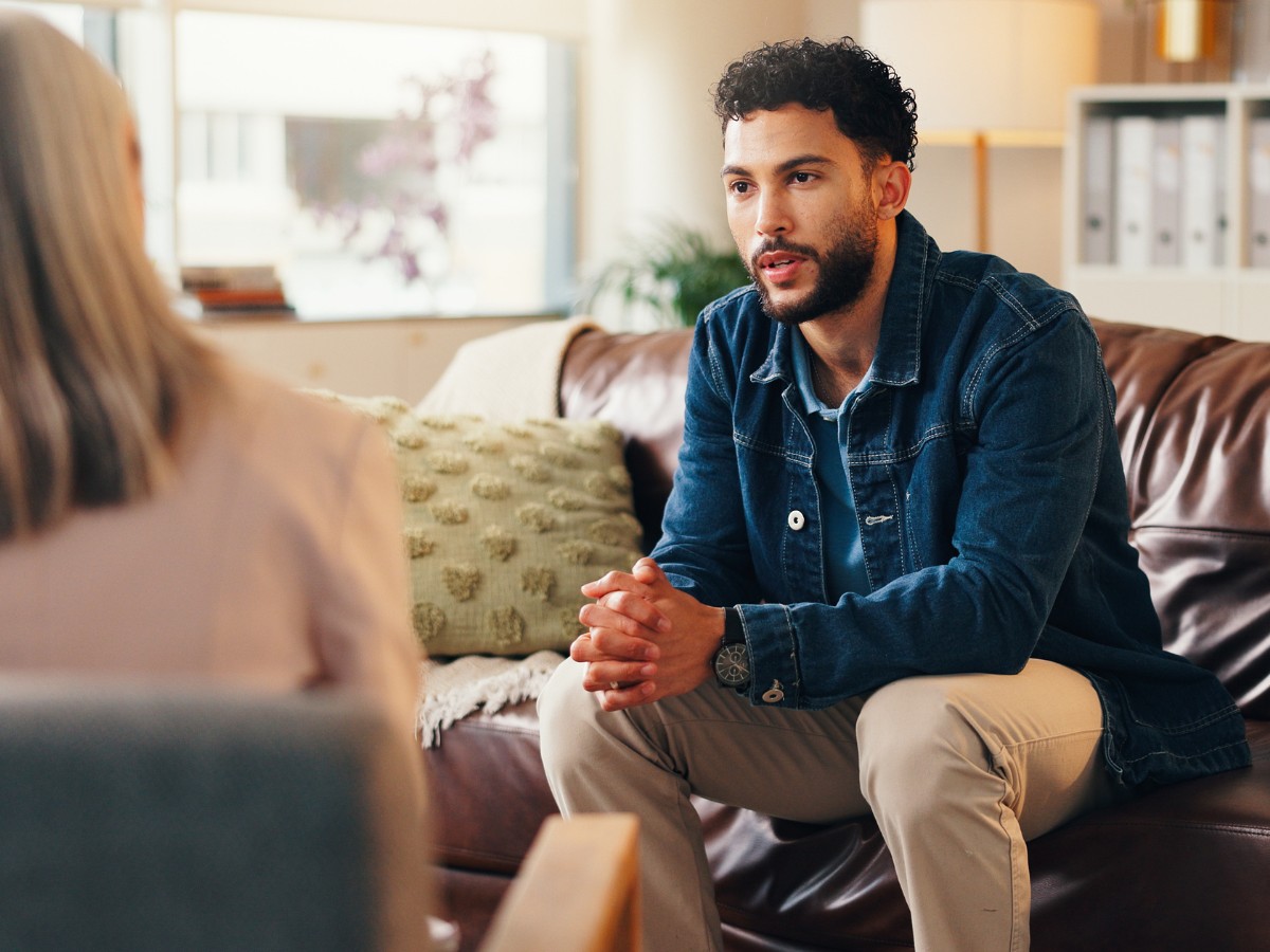 Man speaking with a clinician during a consultation